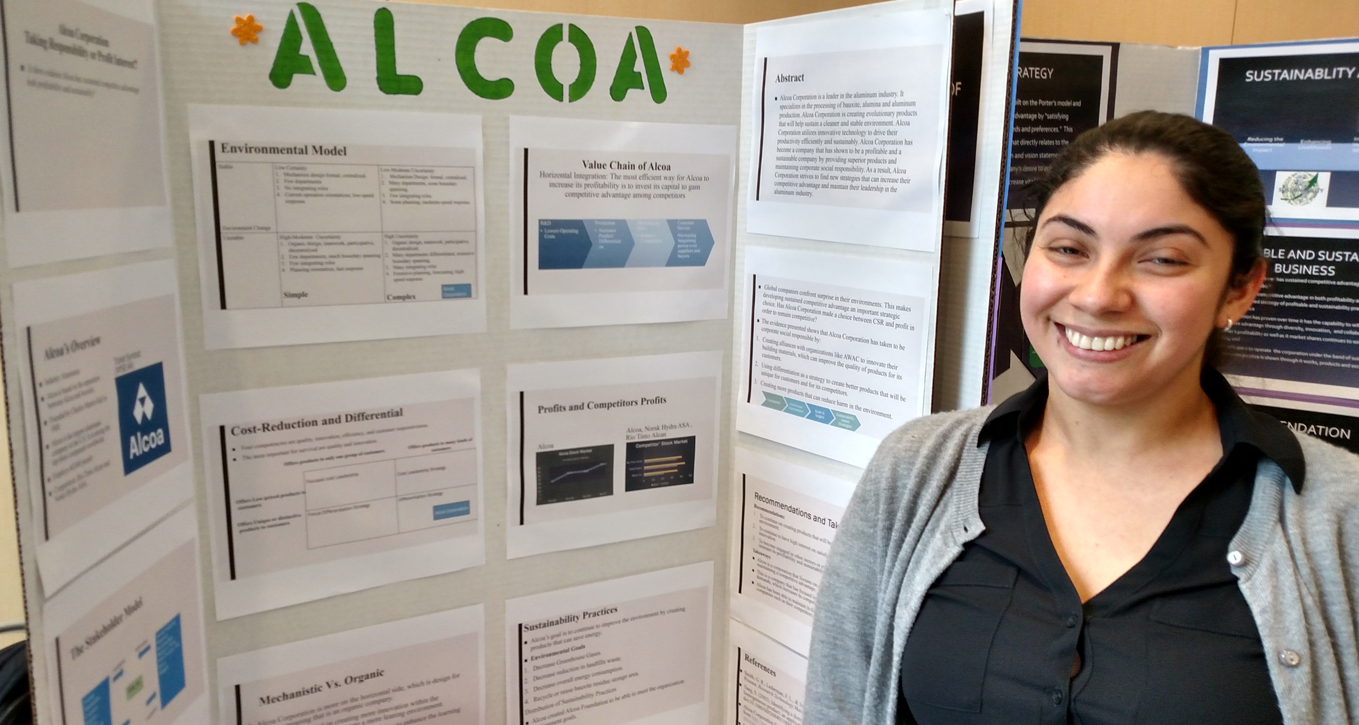 Student Elizabeth Coperno and her research poster on Alcoa